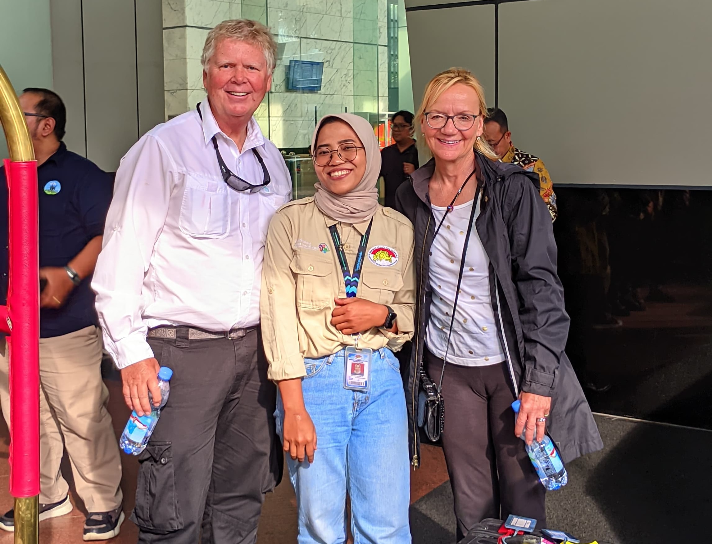 Experienced male guide explaining historical artifacts in museum setting